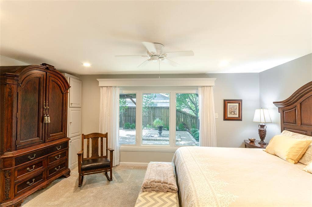 3613 Windmill Hill Street, Waco, TX 76710 Recessed ceiling lighting, ceiling fan, carpeted flooring, built-in cabinetry, and a large window overlooking a paved patio