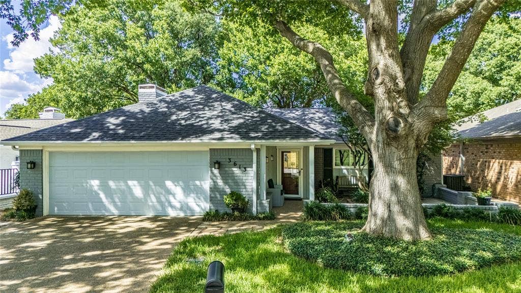 3613 Windmill Hill Street, Waco, TX 76710 Brick exterior with an attached two-car garage, established front yard landscaping, and a mature tree