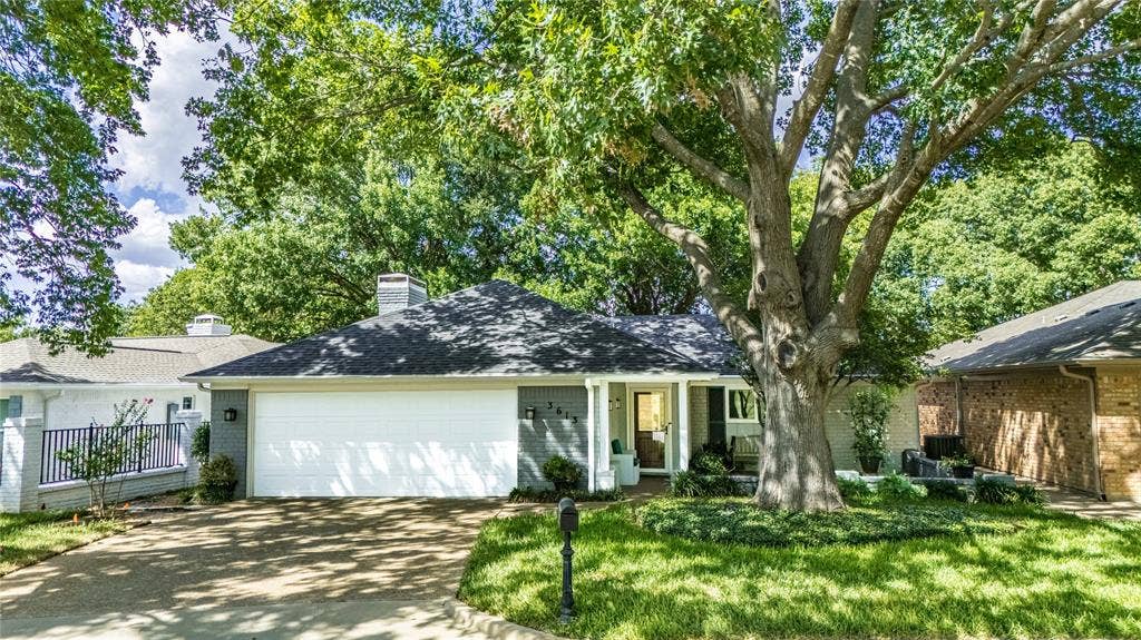 3613 Windmill Hill Street, Waco, TX 76710 Contemporary exterior with a dark gray shingle roof, attached two-car garage, and a concrete driveway