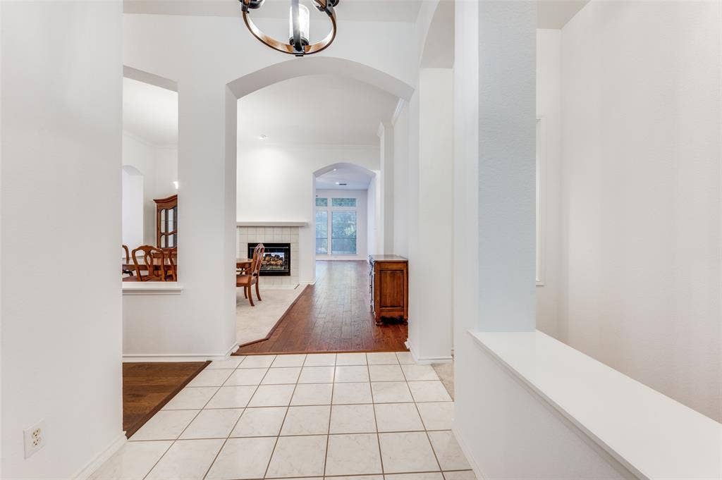 Entryway into this lovely home.  Open floor plan with lots of space—office to the left down the hallway.  The study is on the left once you turn left.  Lots of engineered wood flooring throughout!