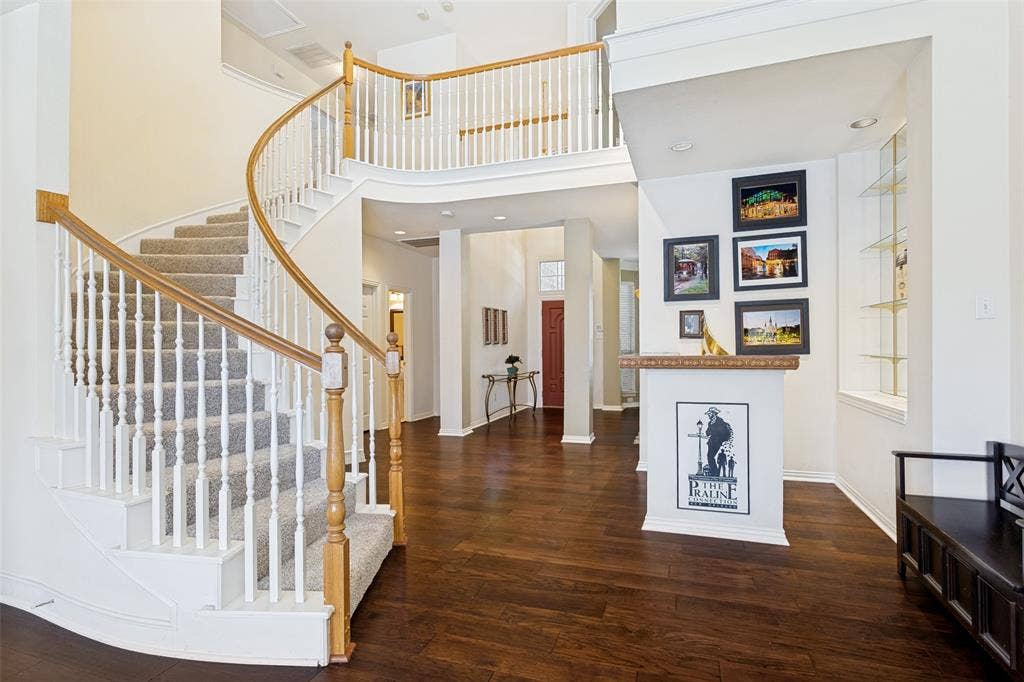 4308 Cedar Valley Drive, Plano, TX 75024 Nice curved staircase with newer carpet with a large Wet bar to the right