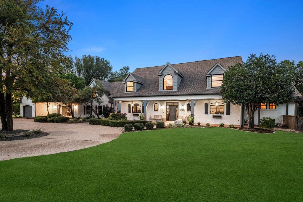7750 Cottonwood Street, Frisco, TX 75033 Impressive curb appeal with mature trees and a welcoming circular drive.