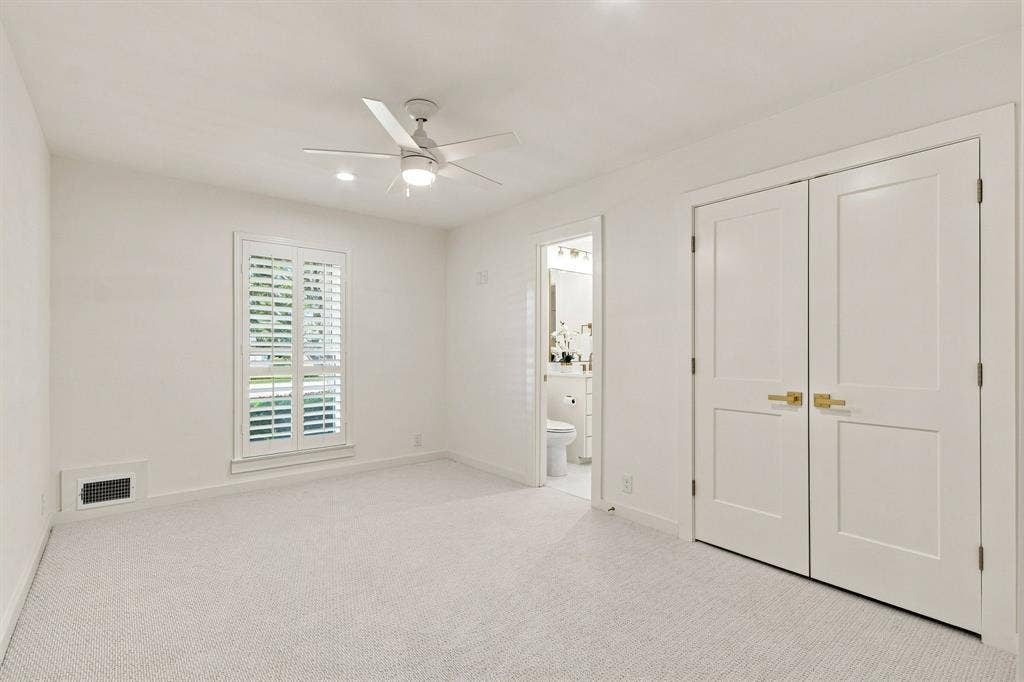 1409 Navaho Trail, Richardson, TX 75080 Recessed lighting, ceiling fan, carpet flooring, window with plantation shutters, and panel doors with brass hardware