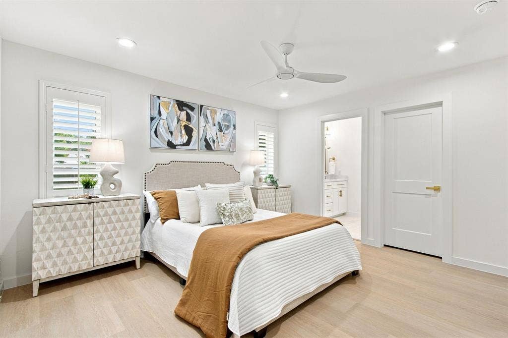 1409 Navaho Trail, Richardson, TX 75080 Light wood-finish flooring, recessed lighting, and a ceiling fan are featured in this room with white walls