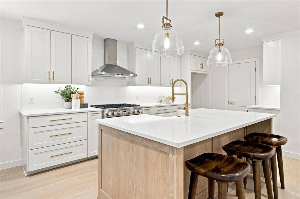 1409 Navaho Trail, Richardson, TX 75080 Kitchen featuring all updated cabinetry, a large kitchen island with overlooking living area.