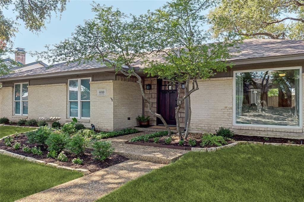Landscaped entry highlights the entrance.