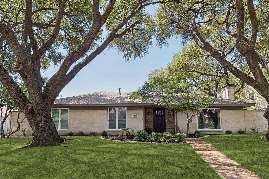 Canopied by majestic oaks sets the stage for this updated beauty.