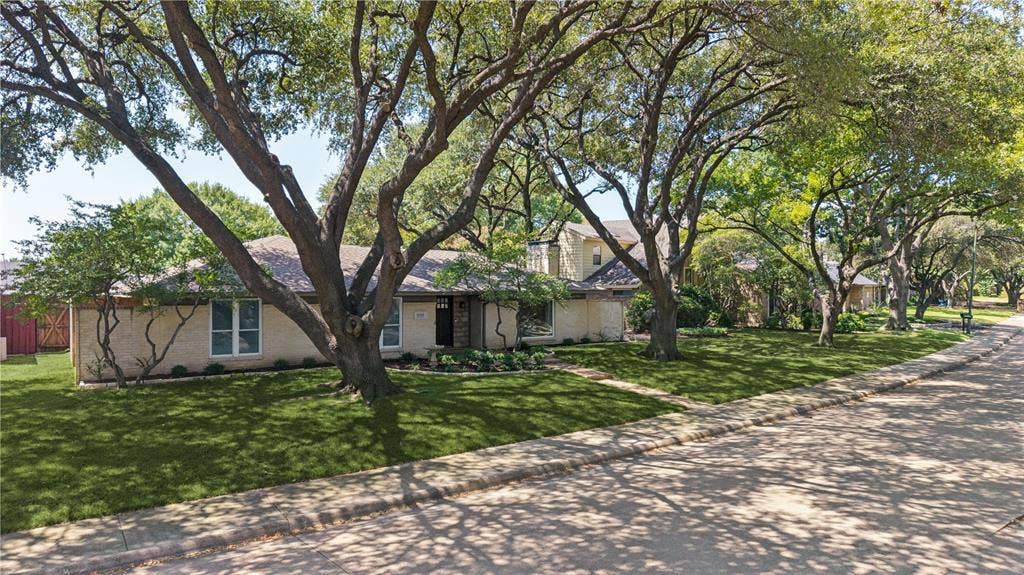 Tree lined street adds neighborhood charm.