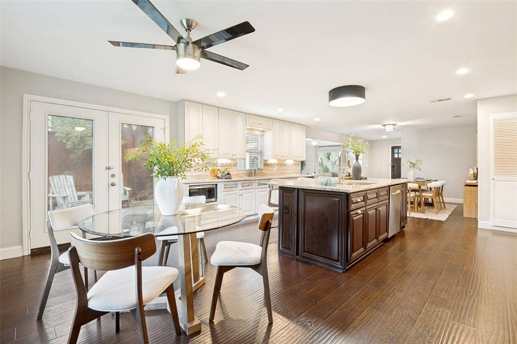 Breakfast area flanks the large kitchen and has french doors leading to the patio.