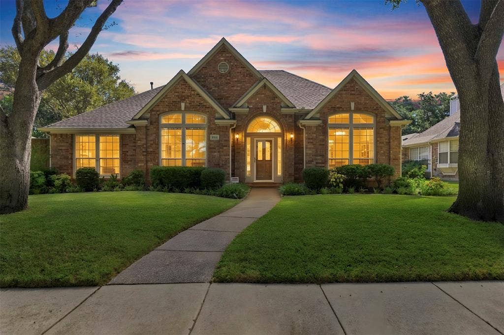 2910 Live Oak Drive, Rowlett, TX 75088 Brick exterior with gabled roof lines