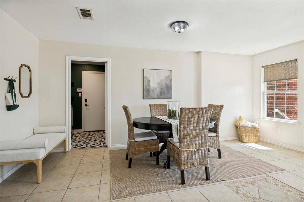 2922 Andrea Lane, Garland, TX 75040 Tiled flooring throughout, recessed lighting fixture, window with privacy blind, and an laundry room with patterned flooring