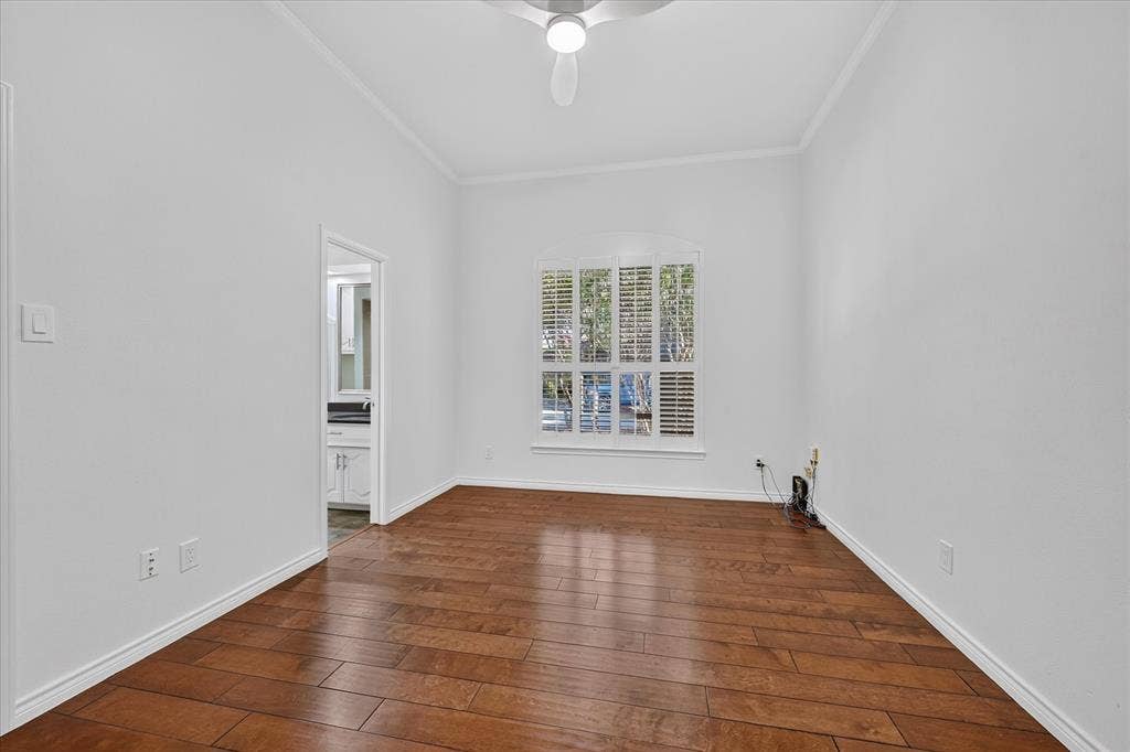 shutters wood-finish flooring ceiling fan large closet