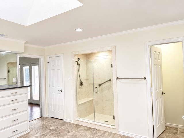Skylight, recessed lighting, and crown molding