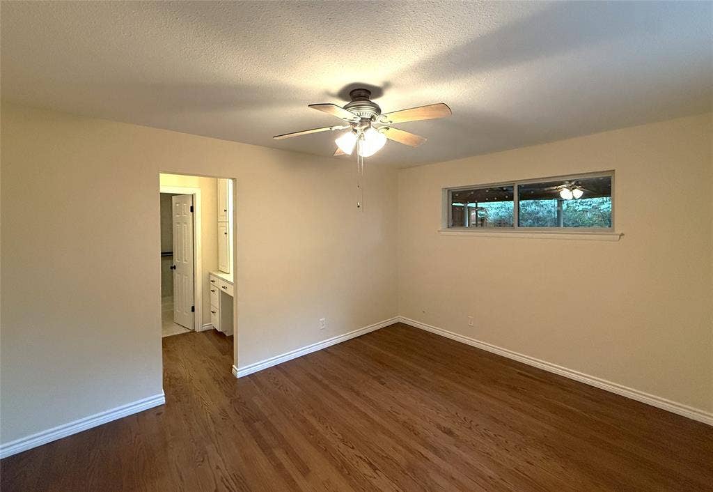 1116 Elizabeth Lane, Richardson, TX 75080 Primary bedroom and entry to dressing area and walk in closet