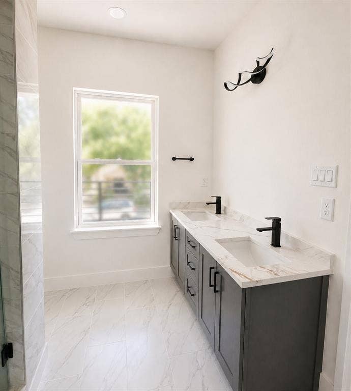 2542 Hooper Street, Dallas, TX 75215 Dual vanity with integrated sinks, matte black faucets, and dark wood-finish cabinetry