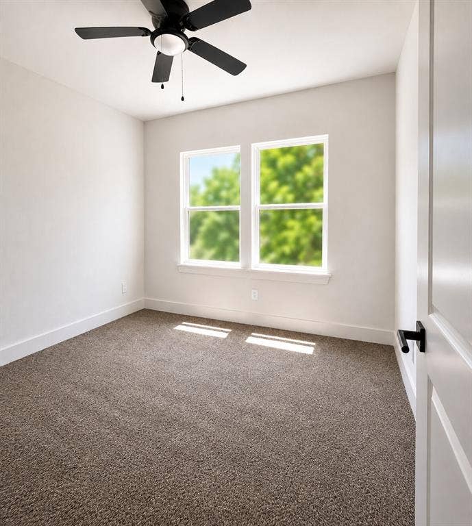 2542 Hooper Street, Dallas, TX 75215 Neutral-toned carpeting, white walls, and a black ceiling fan with an integrated light fixture