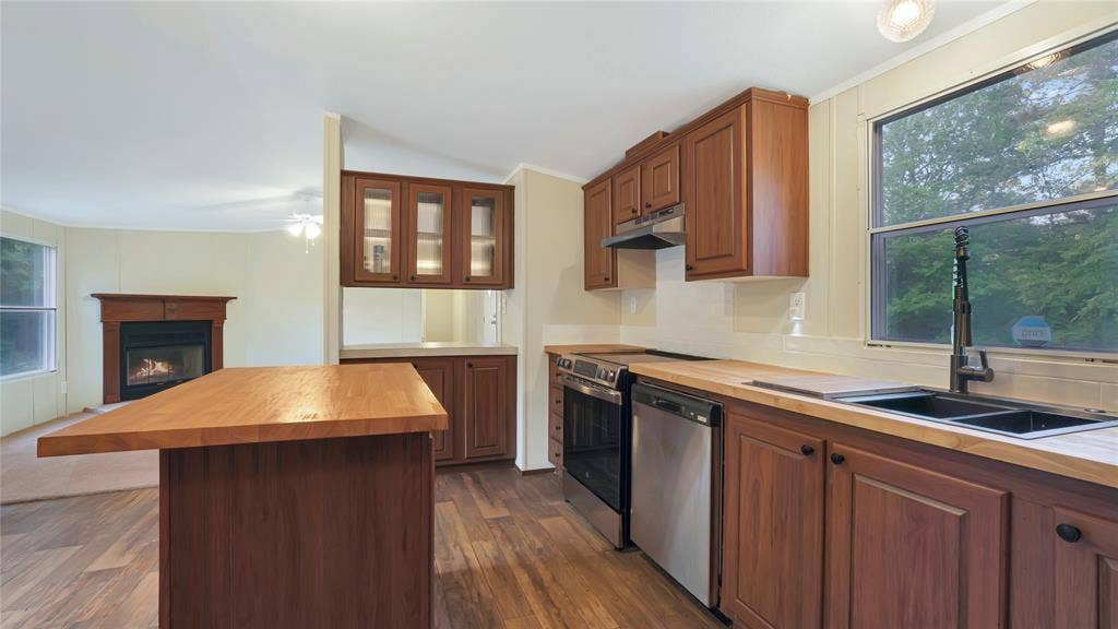 5390 Fm 314 S, Larue, TX 75770 Kitchen featuring wood-finish flooring, wood countertops, stainless steel appliances, and wood cabinetry