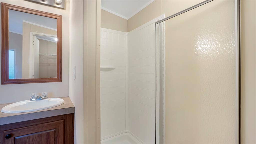 5390 Fm 314 S, Larue, TX 75770 Vanity with an integrated sink and wood-finish cabinetry