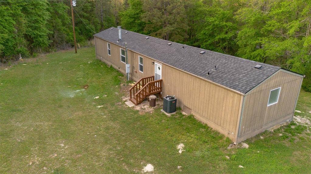 5390 Fm 314 S, Larue, TX 75770 Tan board-and-batten style siding with a dark shingled roof