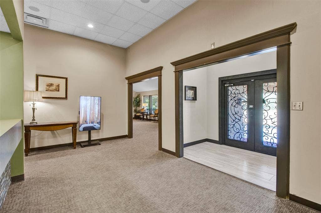 3210 W Northwest Loop 323, Tyler, TX 75702 Entryway featuring double doors with decorative glass panels, light wood-finish flooring, and recessed ceiling lighting
