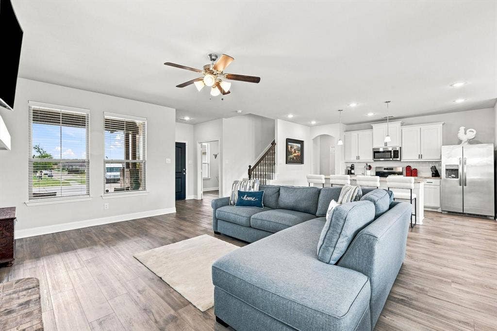 401 Llano Lane, Red Oak, TX 75154 Open-concept living area with wood-finish flooring, recessed lighting, and a ceiling fan