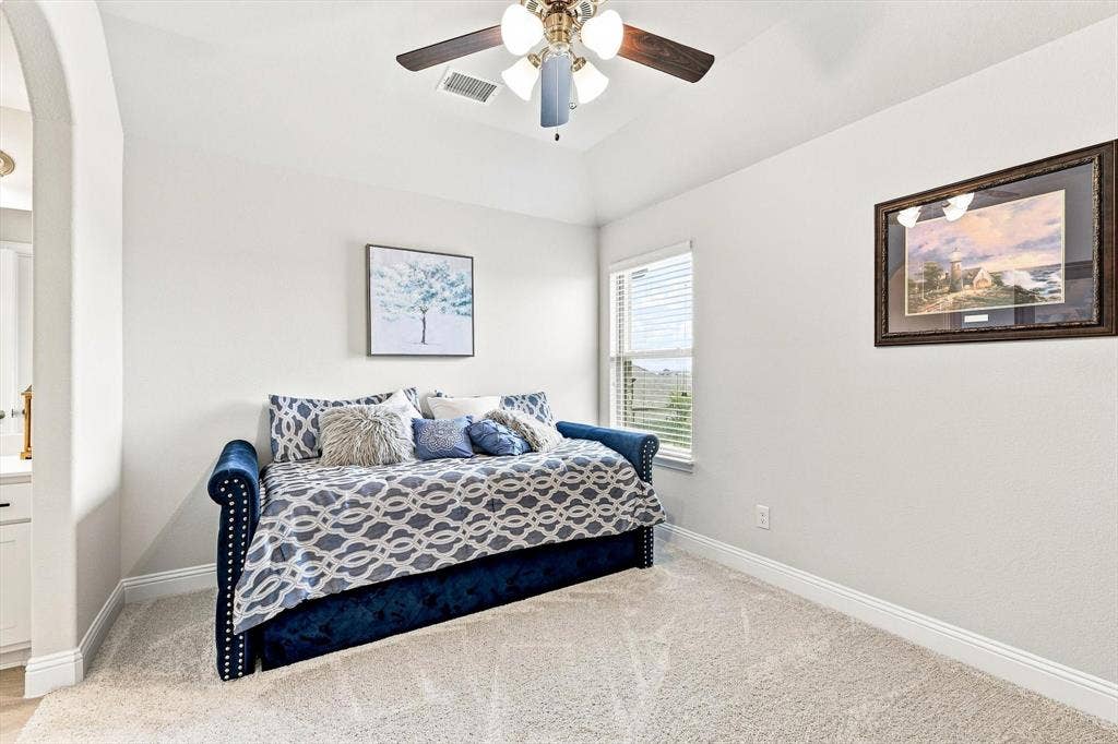 401 Llano Lane, Red Oak, TX 75154 Recessed window with blinds, ceiling fan with integrated lighting, and neutral carpeting