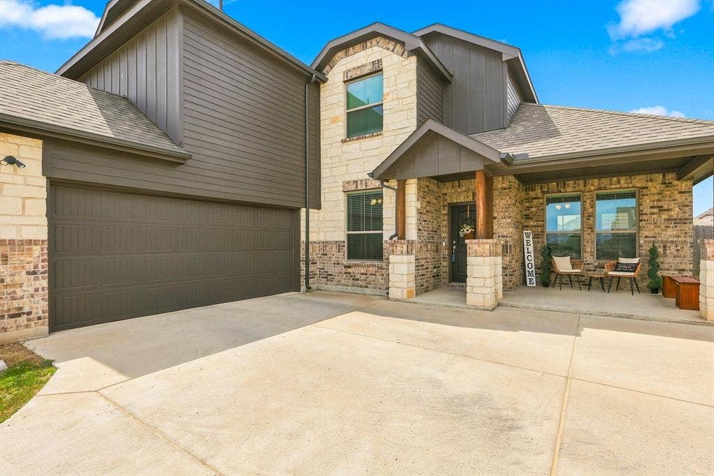 401 Llano Lane, Red Oak, TX 75154 Brick and stone facade with dark siding accents