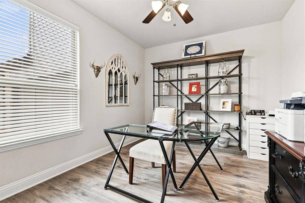 401 Llano Lane, Red Oak, TX 75154 Wood-finish flooring, white walls, and a ceiling fan with integrated lighting