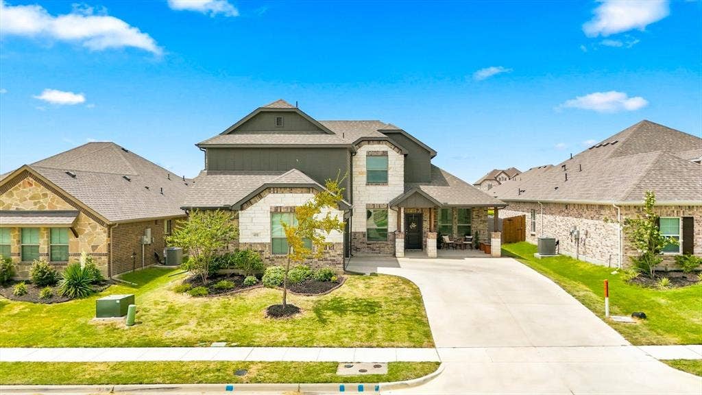 401 Llano Lane, Red Oak, TX 75154 Stone and siding exterior with gabled roof lines
