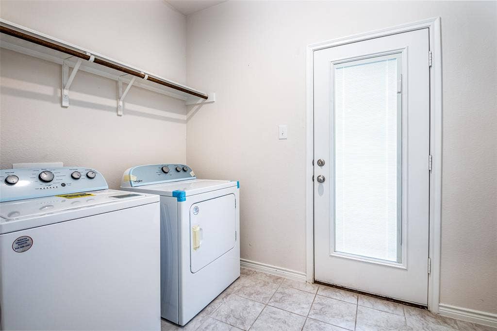 2721 Franklin Drive, Celina, TX 75009 Laundry area featuring tile flooring, white walls, and an exterior door with an inset window