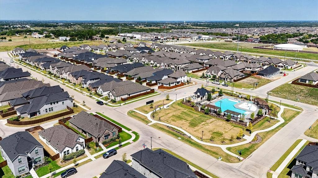 5308 Tupper Avenue, Fate, TX 75087 Community features include a swimming pool, multiple residential structures, paved streets, and landscaped common areas