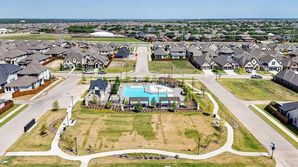 5308 Tupper Avenue, Fate, TX 75087 Community swimming pool with an adjacent amenity building and multiple shade structures