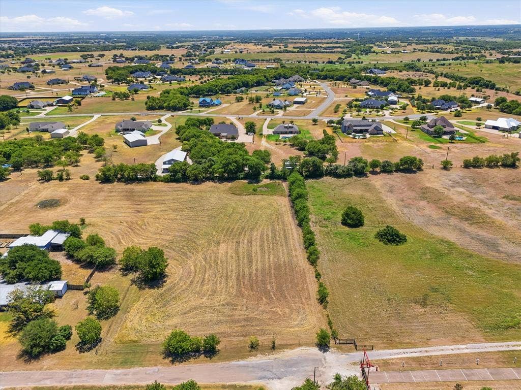 TBD Lot 1 Bluebonnett Lane, Lorena, TX 76655 Expansive undeveloped lot featuring varied topography and perimeter tree line