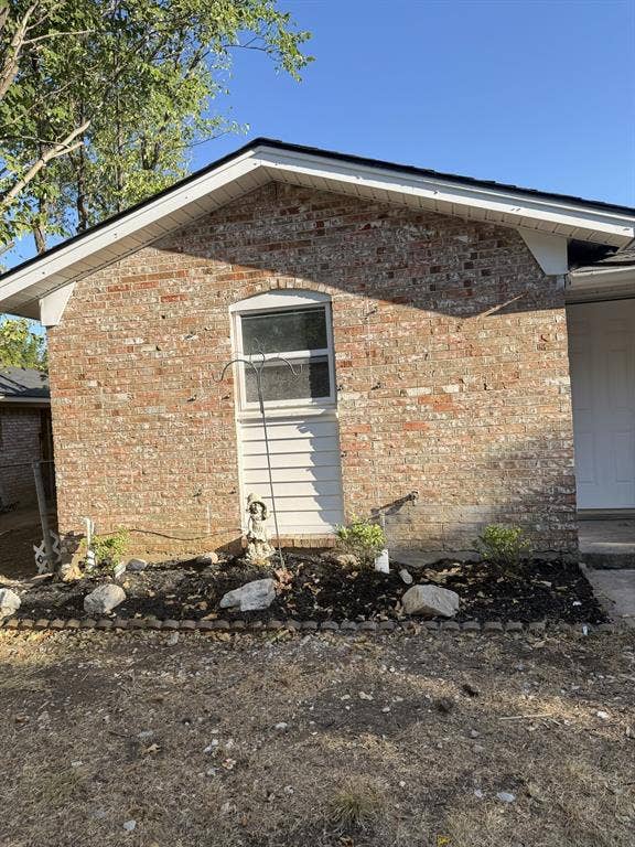806 S Atkerson Lane, Euless, TX 76040 Brick exterior with white trim and shingle roof