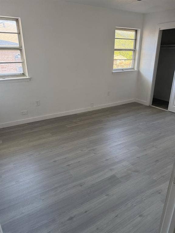 806 S Atkerson Lane, Euless, TX 76040 Recessed lighting, wood-finish flooring, white walls, and two windows