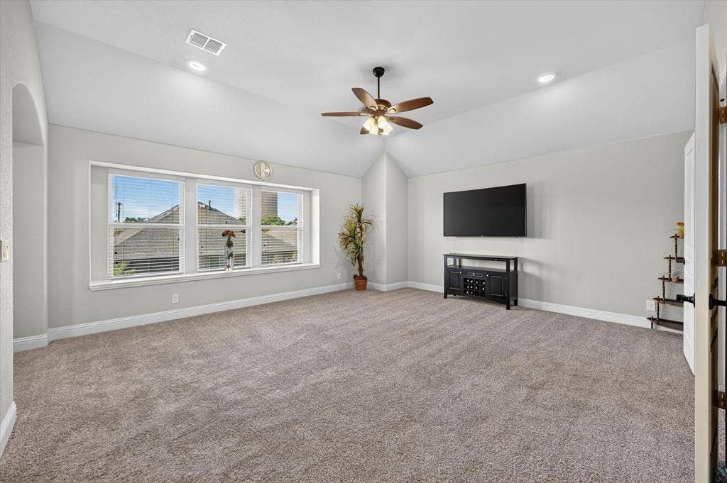 316 Jernigan Drive, Euless, TX 76040 Vaulted ceiling with a ceiling fan, recessed lighting, and large windows with blinds