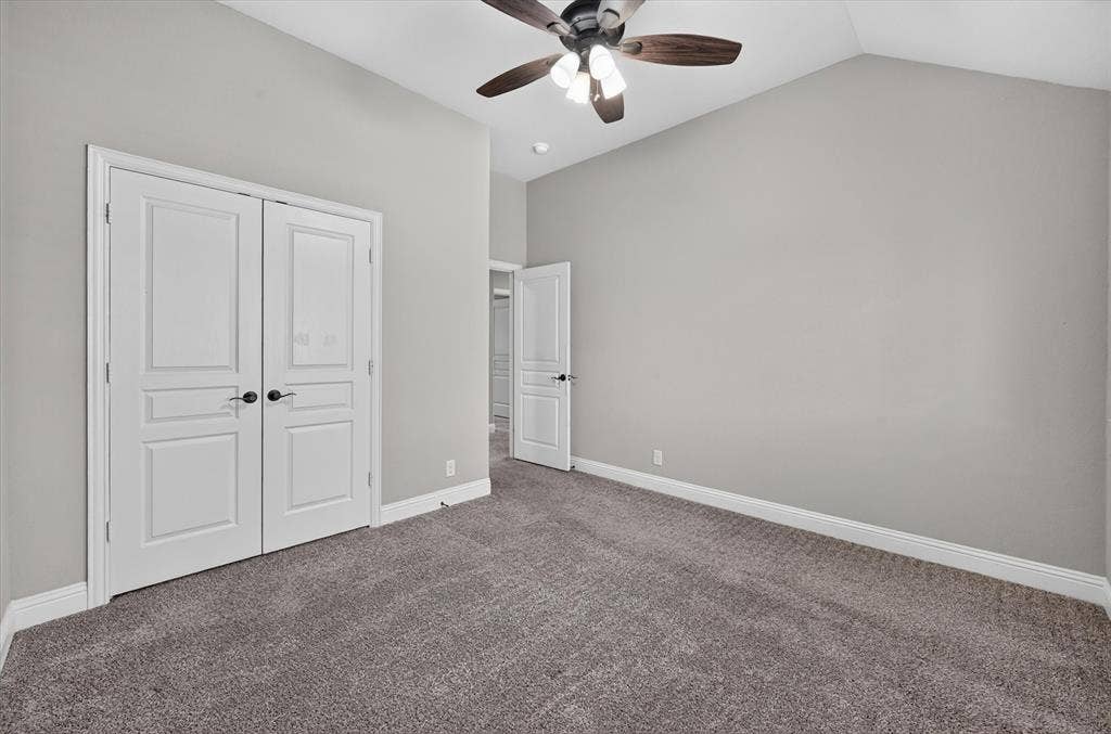 316 Jernigan Drive, Euless, TX 76040 Vaulted ceiling with a ceiling fan, neutral wall tones, and gray carpeting