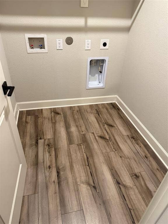 1001 Calhoun Drive, Anna, TX 75409 Wood-finish plank flooring with white baseboards