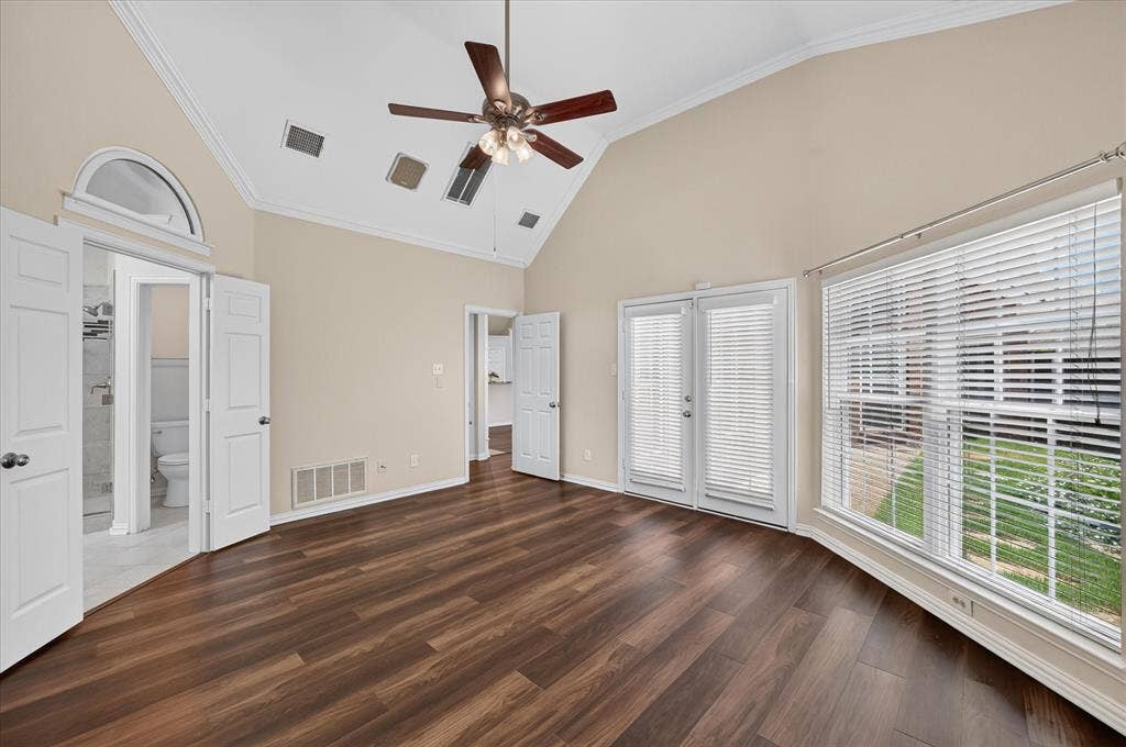10307 Perkins Drive, Irving, TX 75063 Vaulted ceiling, wood-finish flooring, ceiling fan with integrated lighting, double French doors, and large window