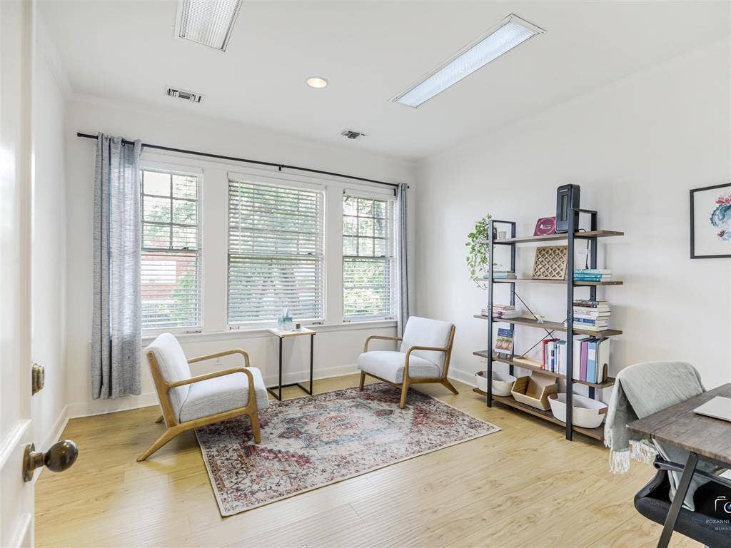 4310 Gaston Avenue, #103, Dallas, TX 75246 Hardwood-style flooring, recessed lighting, white walls, and multiple windows with blinds