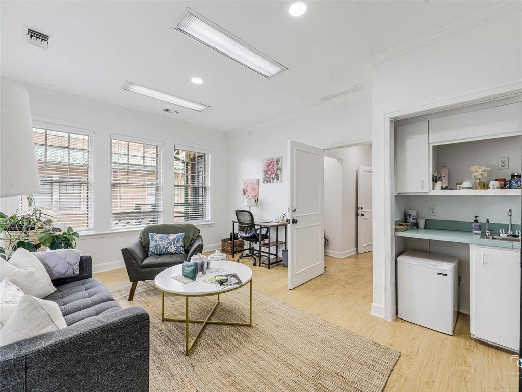 4310 Gaston Avenue, #103, Dallas, TX 75246 White walls, wood-finish flooring, and recessed lighting