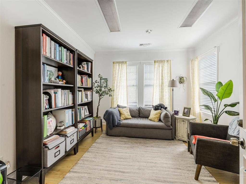 4310 Gaston Avenue, #103, Dallas, TX 75246 Recessed lighting, crown molding, wood-finish flooring, two large windows, built-in shelving