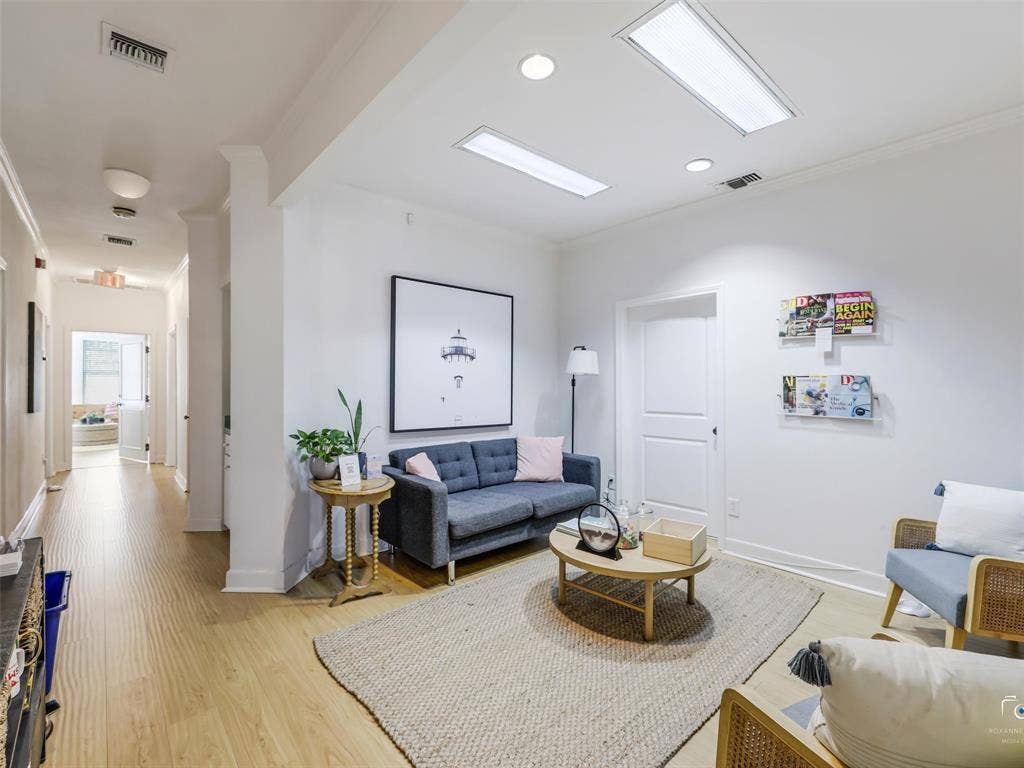 4310 Gaston Avenue, #103, Dallas, TX 75246 Recessed lighting, wood-finish flooring, white paneled doors, and ceiling-mounted light panels