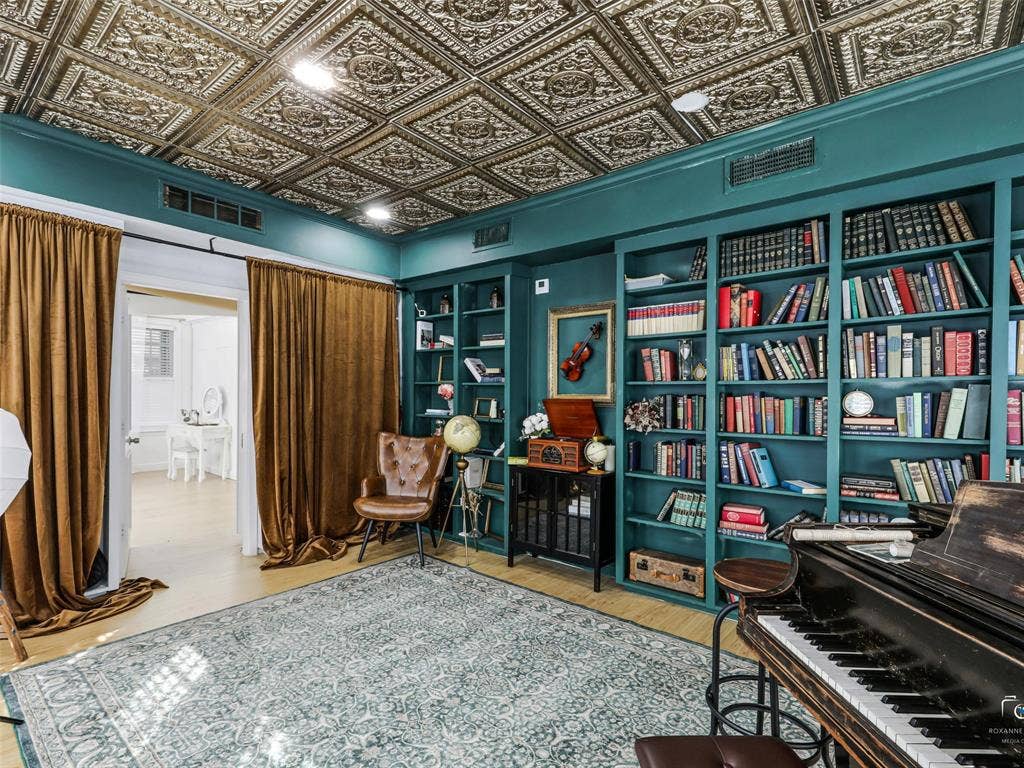 4310 Gaston Avenue, #103, Dallas, TX 75246 Decorative ceiling tiles, built-in shelving, wood-finish flooring, and recessed lighting