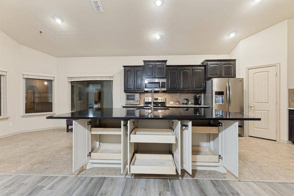 10808 Ersebrook Court, Fort Worth, TX 76052 Additional storage under custom island with slow close drawers