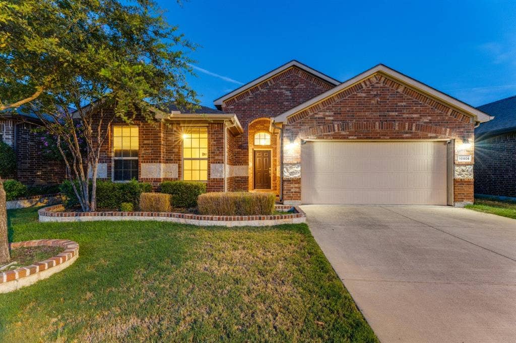 10808 Ersebrook Court, Fort Worth, TX 76052 Driveway into 2 car garage and front view.
