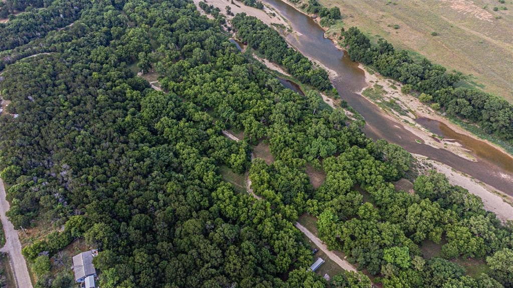 3018 River View Court, Granbury, TX 76048 Expansive natural landscape featuring dense tree coverage