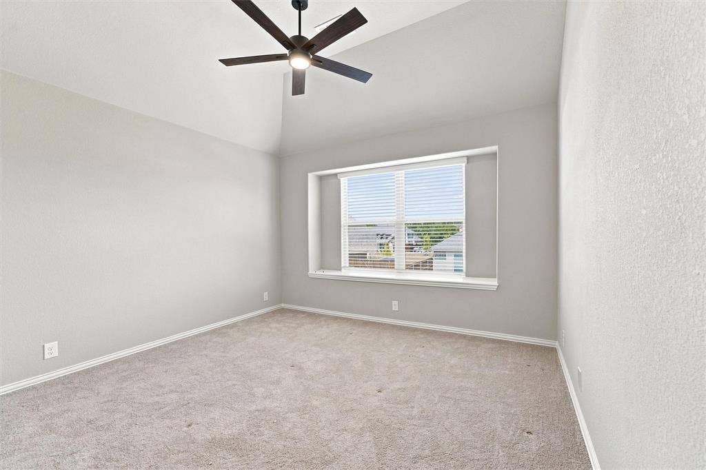 5225 Rowlan Row, Midlothian, TX 76065 Vaulted ceiling with a ceiling fan, neutral carpeting, and a window with blinds