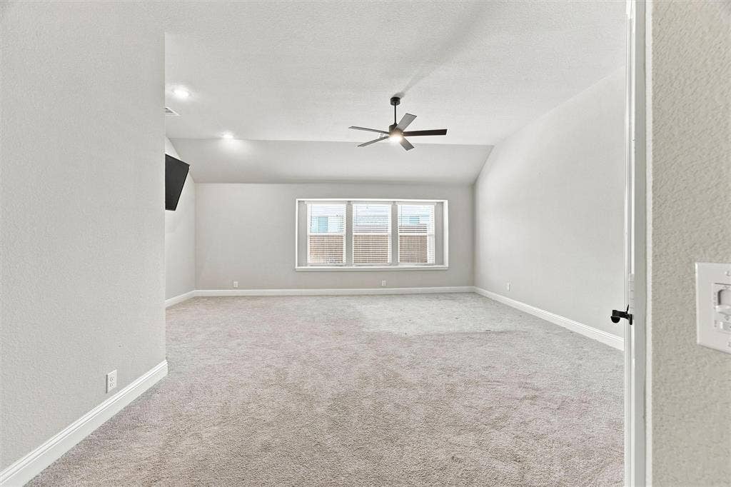 5225 Rowlan Row, Midlothian, TX 76065 Spacious bedroom flooded with natural light from triple casement windows