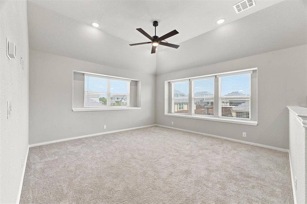 5225 Rowlan Row, Midlothian, TX 76065 Vaulted ceiling featuring a ceiling fan, recessed lighting, and multiple windows with blinds